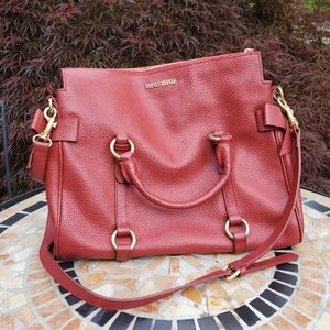 Miu Miu dark red leather bow bag.